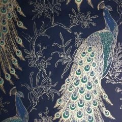 A navy blue wallpaper with peacocks and flowers all over the surface lined in with gold.